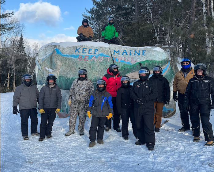 Group photo from snowmobile trip